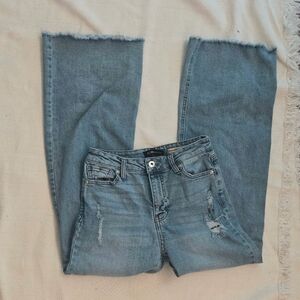 BCBGeneration Light Blue Flare Jeans with Frayed Hem